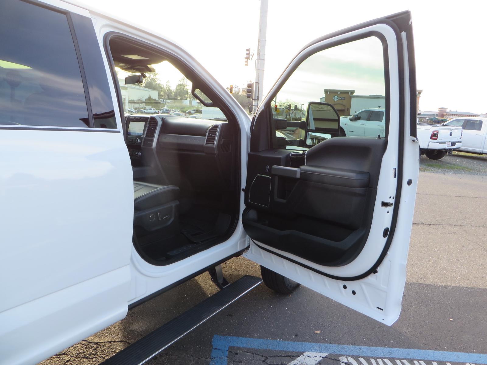 2020 White /BLACK Ford F-450 SD PlatinumCrew Cab DRW 4WD (1FT8W4DT4LE) with an 6.7L V8 OHV 16V DIESEL engine, 6A transmission, located at 2630 Grass Valley Highway, Auburn, CA, 95603, (530) 508-5100, 38.937893, -121.095482 - Must see F450 with a tool box refueling station, window tint, and a center console vault. - Photo #46